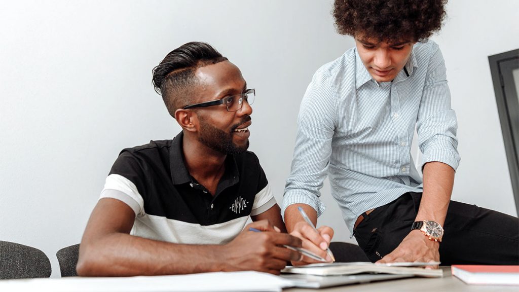 Two people working at a table