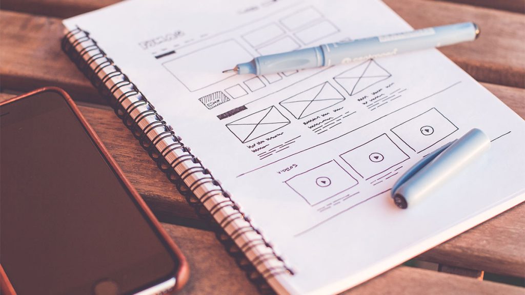 Notebook with wireframing drawings