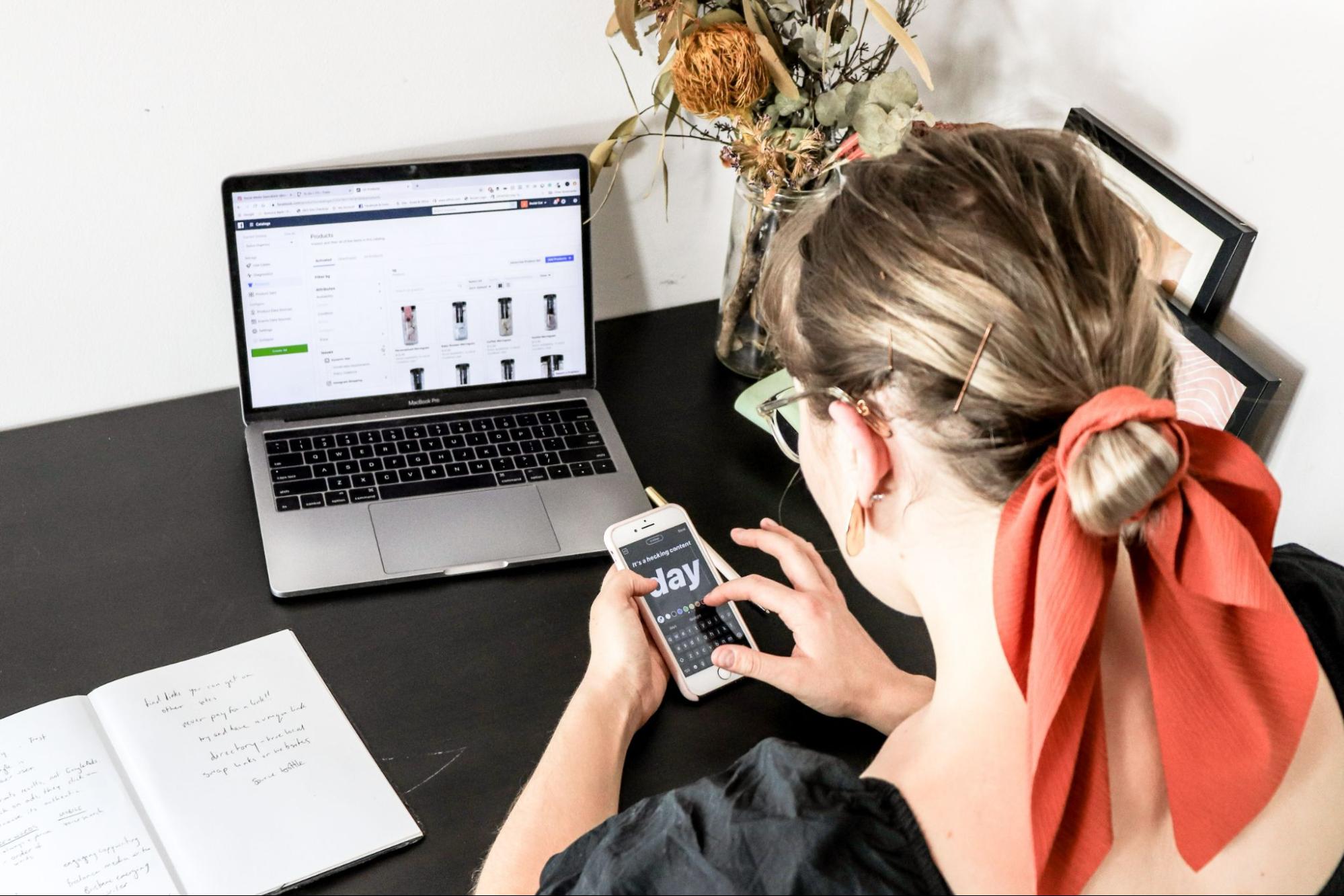 woman-on-phone-with-laptop-open-working